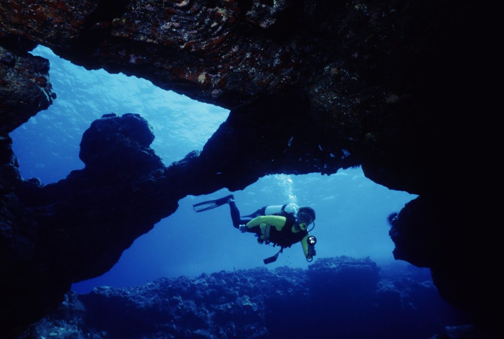 Male Diver in Underwater Cave